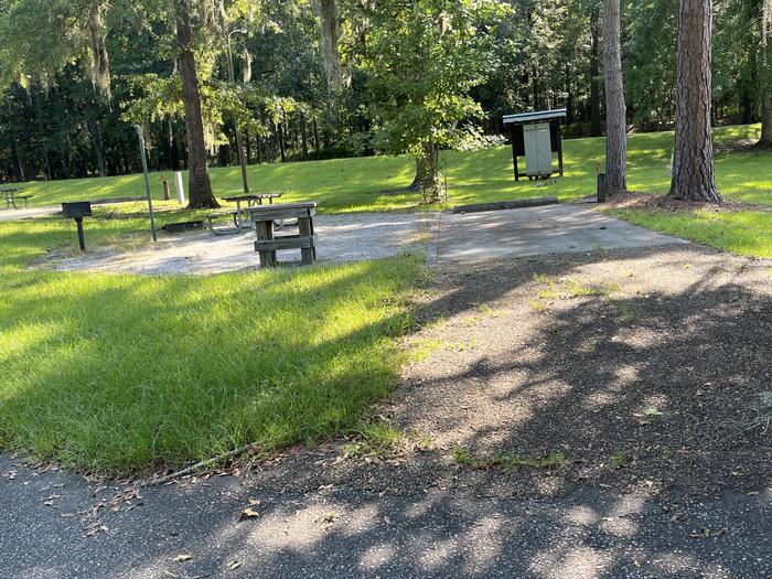 A photo of Site 80 of Loop CLOO at BLUFF CREEK with Picnic Table, Electricity Hookup, Sewer Hookup, Fire Pit, Shade, Food Storage, Tent Pad, Full Hookup, Lantern Pole, Water Hookup