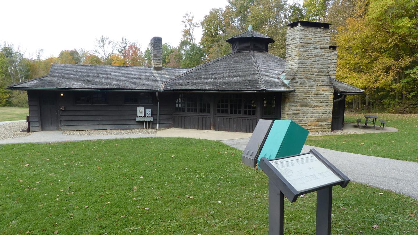 Exterior of the Octagon Shelter with a graphic panel exhibit about it's history