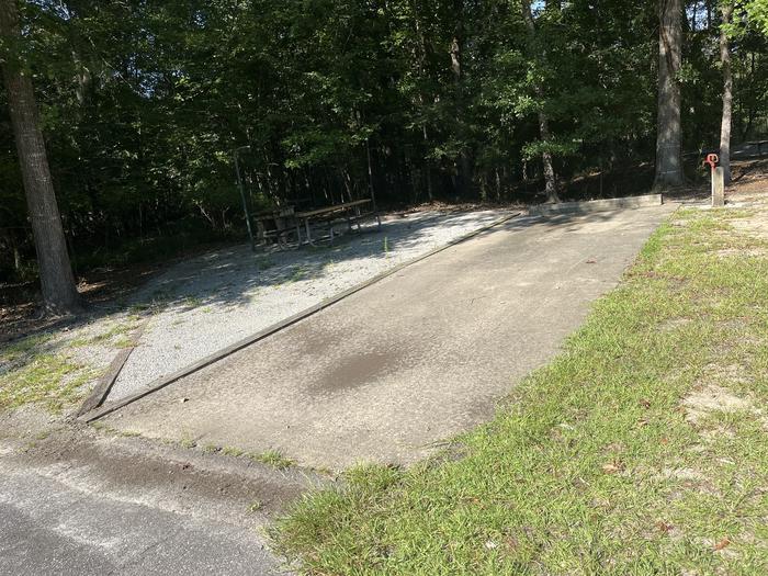 A photo of Site 86 of Loop CLOO at BLUFF CREEK with Picnic Table, Electricity Hookup, Sewer Hookup, Fire Pit, Shade, Tent Pad, Full Hookup, Lantern Pole, Water Hookup