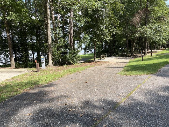 A photo of Site 122 of Loop RCHA at WHITE OAK (CREEK) CAMPGROUND with Picnic Table, Sewer Hookup, Fire Pit, Shade, Tent Pad, Full Hookup, Waterfront, Lantern Pole, Water Hookup