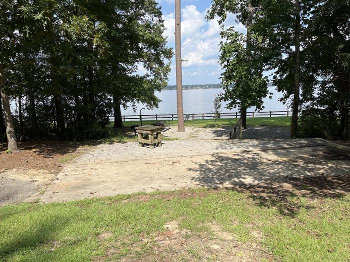 A photo of Site 122 of Loop RCHA at WHITE OAK (CREEK) CAMPGROUND with Picnic Table, Sewer Hookup, Fire Pit, Tent Pad, Full Hookup, Waterfront, Lantern Pole, Water Hookup
