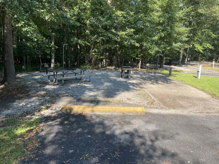 A photo of Site 88 of Loop CLOO at BLUFF CREEK with Picnic Table, Electricity Hookup, Sewer Hookup, Fire Pit, Shade, Tent Pad, Full Hookup, Lantern Pole, Water Hookup