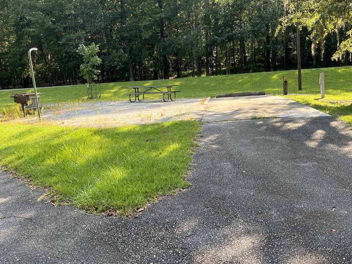 A photo of Site 77 of Loop CLOO at BLUFF CREEK with Picnic Table, Electricity Hookup, Sewer Hookup, Fire Pit, Shade, Full Hookup, Lantern Pole, Water Hookup