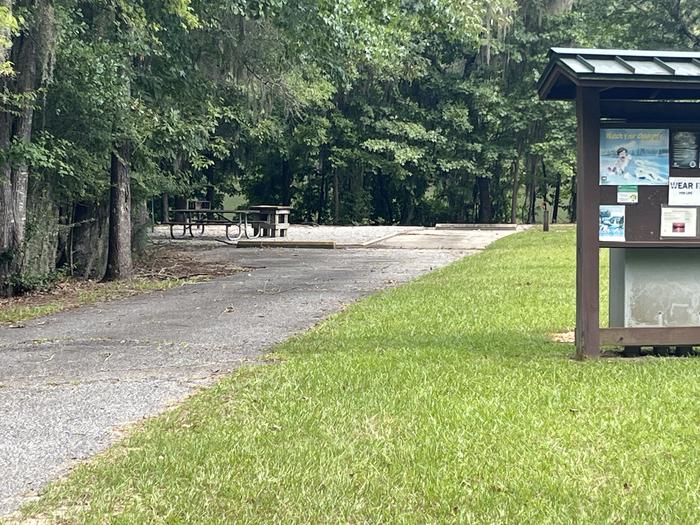 A photo of Site 57 of Loop RFOR at BLUFF CREEK with Picnic Table, Electricity Hookup, Sewer Hookup, Fire Pit, Shade, Tent Pad, Full Hookup, Waterfront, Lantern Pole, Water Hookup