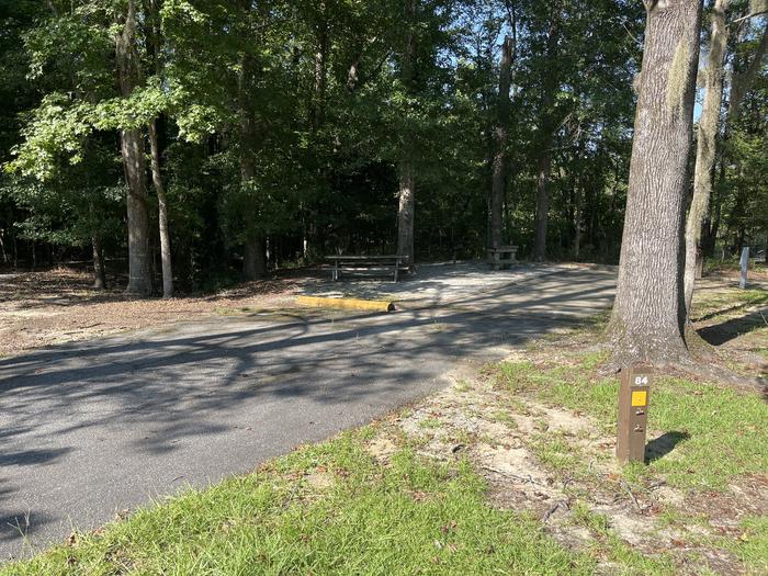 A photo of Site 84 of Loop CLOO at BLUFF CREEK with Picnic Table, Electricity Hookup, Sewer Hookup, Fire Pit, Shade, Tent Pad, Full Hookup, Lantern Pole, Water Hookup