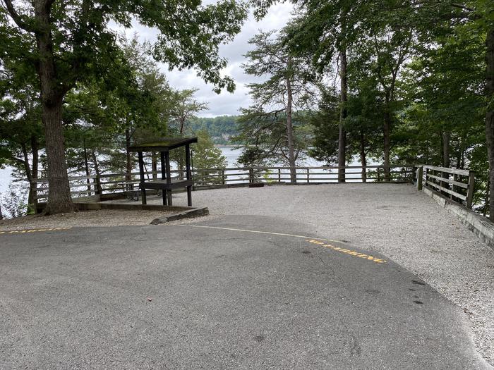 A photo of Site 11 of Loop CPOI at CUMBERLAND POINT CAMPGROUND with Picnic Table, Electricity Hookup, Fire Pit, Shade, Waterfront, Lantern Pole, Water Hookup
