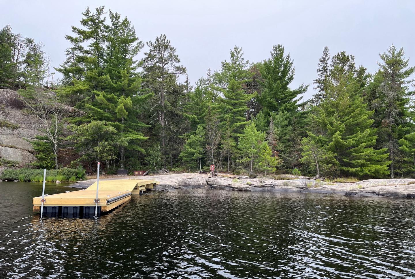 View of dock landing and campsite from water.Dock landing and campsite from water