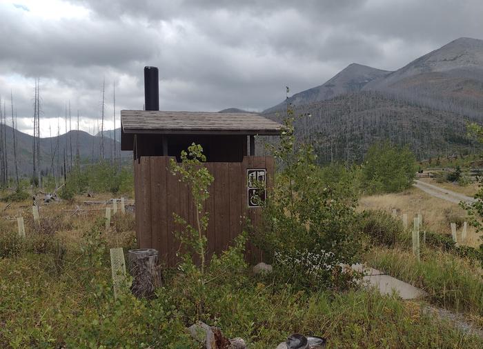 Outhouse on cloudy day with mountain in backgroundWest Fork Facilities (Outhouse)