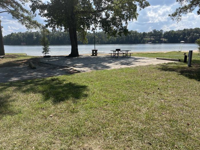 A photo of Site 088 of Loop CVIE at WHITE OAK (CREEK) CAMPGROUND with Boat Ramp, Picnic Table, Electricity Hookup, Sewer Hookup, Fire Pit, Shade, Tent Pad, Full Hookup, Waterfront, Lantern Pole, Water Hookup