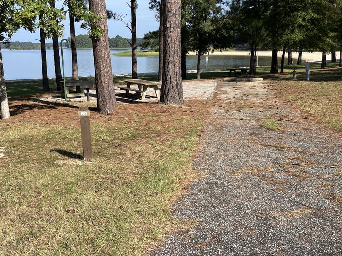 A photo of Site 080 of Loop PINE at COTTON HILL with Picnic Table, Electricity Hookup, Sewer Hookup, Fire Pit, Full Hookup, Waterfront, Lantern Pole, Water Hookup