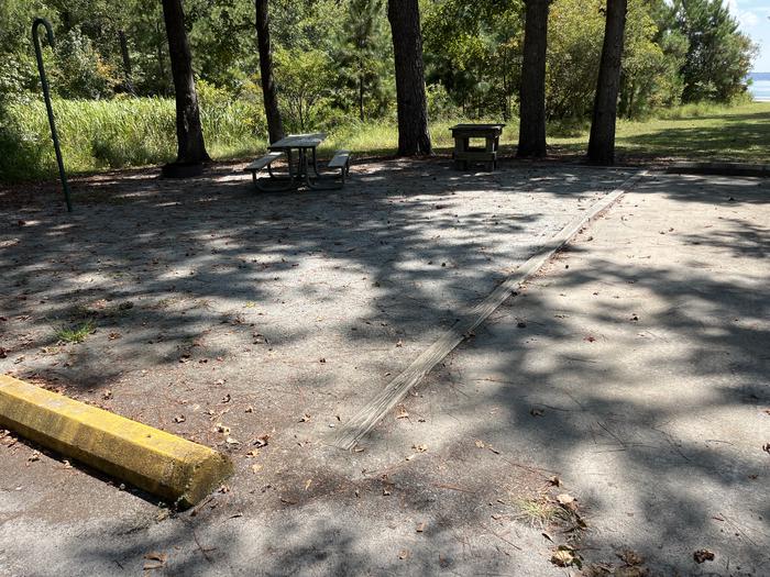 A photo of Site 096 of Loop CVIE at WHITE OAK (CREEK) CAMPGROUND with Picnic Table, Electricity Hookup, Fire Pit, Shade, Lantern Pole, Water Hookup