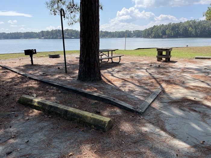 A photo of Site 092 of Loop CVIE at WHITE OAK (CREEK) CAMPGROUND with Picnic Table, Electricity Hookup, Fire Pit, Waterfront, Lantern Pole, Water Hookup