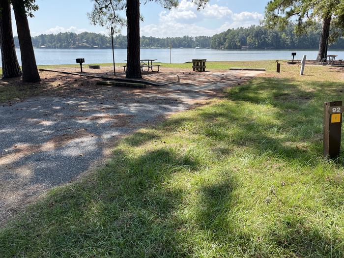 A photo of Site 092 of Loop CVIE at WHITE OAK (CREEK) CAMPGROUND with Picnic Table, Electricity Hookup, Fire Pit, Waterfront, Lantern Pole, Water Hookup