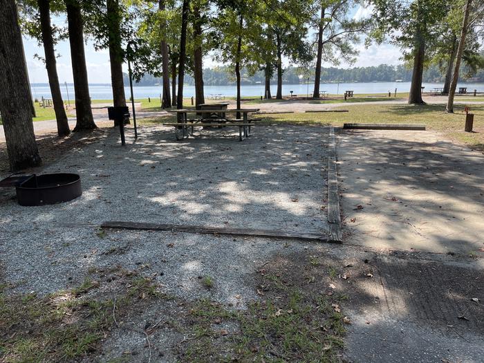 A photo of Site 097 of Loop CVIE at WHITE OAK (CREEK) CAMPGROUND with Picnic Table, Electricity Hookup, Fire Pit, Shade, Lantern Pole, Water Hookup