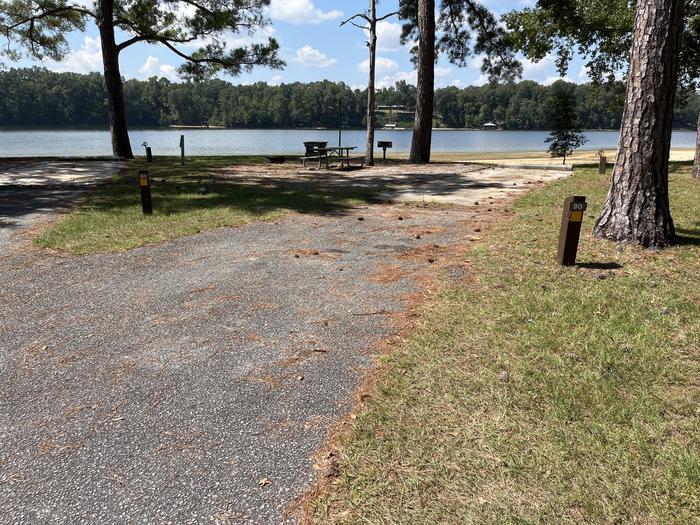 A photo of Site 090 of Loop CVIE at WHITE OAK (CREEK) CAMPGROUND with Picnic Table, Electricity Hookup, Fire Pit, Waterfront, Lantern Pole, Water Hookup