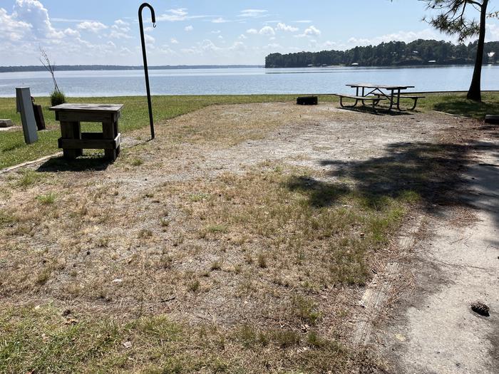 A photo of Site 093 of Loop CVIE at WHITE OAK (CREEK) CAMPGROUND with Picnic Table, Electricity Hookup, Fire Pit, Waterfront, Lantern Pole, Water Hookup