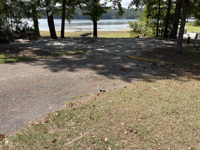 A photo of Site 107 of Loop RCHA at WHITE OAK (CREEK) CAMPGROUND with Picnic Table, Electricity Hookup, Fire Pit, Waterfront, Lantern Pole, Water Hookup