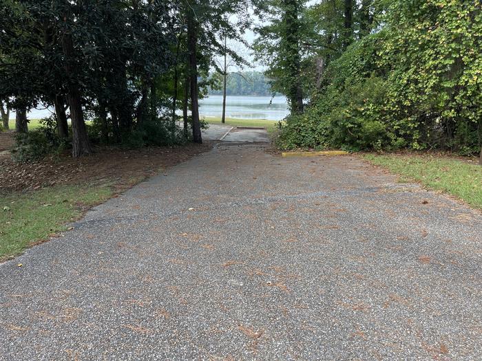 A photo of Site 108 of Loop RCHA at WHITE OAK (CREEK) CAMPGROUND with Picnic Table, Electricity Hookup, Fire Pit, Shade, Waterfront, Lantern Pole, Water Hookup