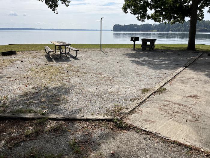 A photo of Site 112 of Loop RCHA at WHITE OAK (CREEK) CAMPGROUND with Picnic Table, Electricity Hookup, Fire Pit, Waterfront, Lantern Pole, Water Hookup