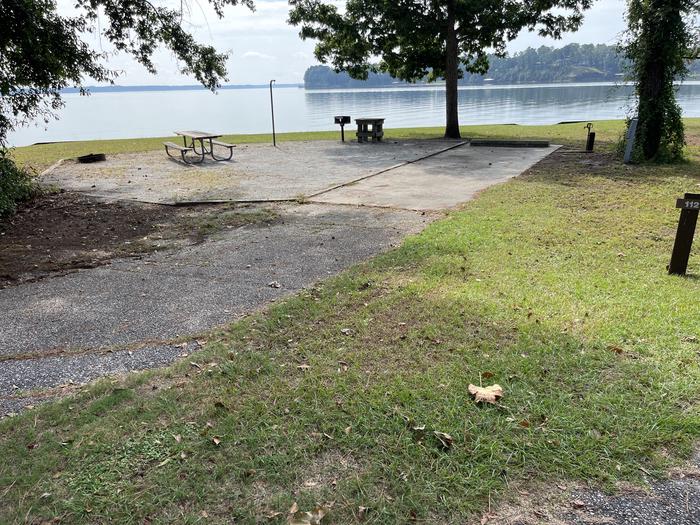 A photo of Site 112 of Loop RCHA at WHITE OAK (CREEK) CAMPGROUND with Picnic Table, Electricity Hookup, Fire Pit, Waterfront, Lantern Pole, Water Hookup