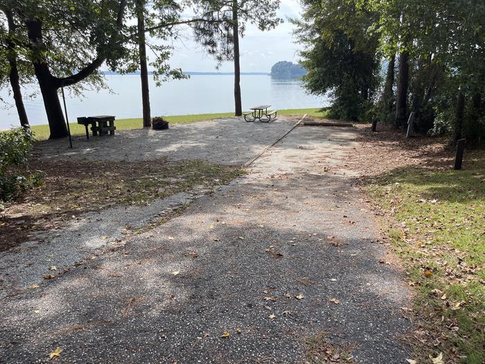 A photo of Site 115 of Loop RCHA at WHITE OAK (CREEK) CAMPGROUND with Picnic Table, Electricity Hookup, Fire Pit, Waterfront, Lantern Pole, Water Hookup