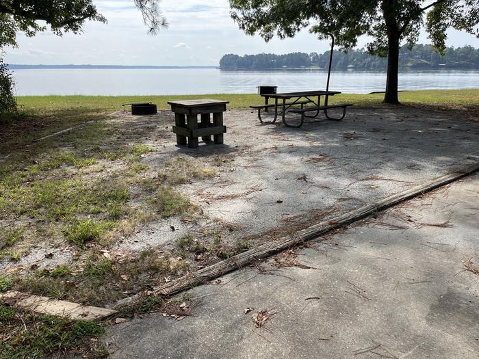 A photo of Site 113 of Loop RCHA at WHITE OAK (CREEK) CAMPGROUND with Picnic Table, Electricity Hookup, Fire Pit, Waterfront, Lantern Pole, Water Hookup