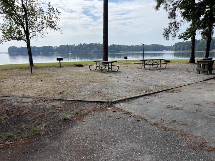 A photo of Site 110/111 of Loop RCHA at WHITE OAK (CREEK) CAMPGROUND with Picnic Table, Electricity Hookup, Fire Pit, Waterfront, Lantern Pole, Water Hookup