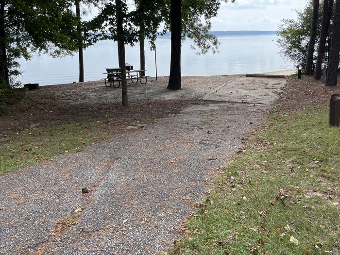 A photo of Site 117 of Loop RCHA at WHITE OAK (CREEK) CAMPGROUND with Picnic Table, Electricity Hookup, Fire Pit, Shade, Waterfront, Lantern Pole, Water Hookup
