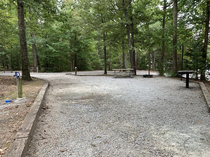 A photo of Site 209 of Loop D at NORTH BEND PARK with Picnic Table, Electricity Hookup, Fire Pit, Shade, Tent Pad, Lantern Pole, Water Hookup
