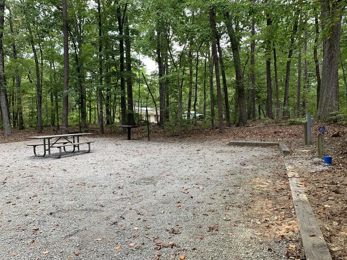 A photo of Site 211 of Loop D at NORTH BEND PARK with Picnic Table, Electricity Hookup, Shade, Tent Pad, Lantern Pole, Water Hookup