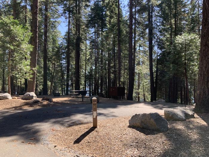 A photo of Site 114 of Loop AREA SUNSET-UNION VALLEY at SUNSET-UNION VALLEY with Picnic Table, Fire Pit, Shade, Food Storage, Tent Pad, Waterfront