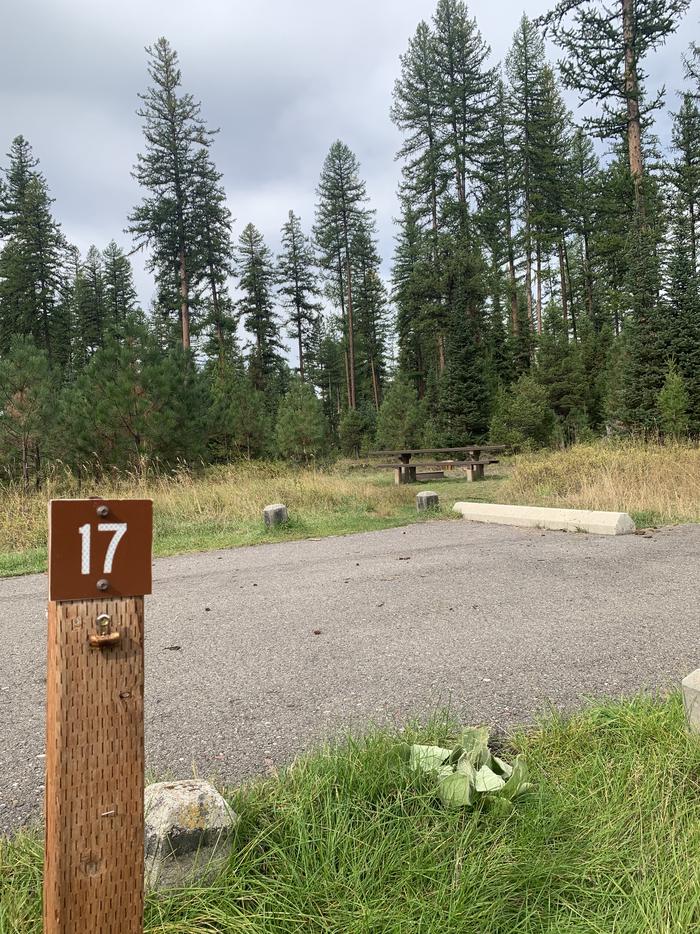 A photo of Site BLS17 in Loop 2 at Big Larch Campground with a campsite marker, parking area. 