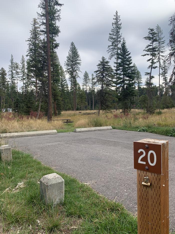 A photo of Site BLS20 in Loop 2 at Big Larch Campground with campsite marker, parking area. 