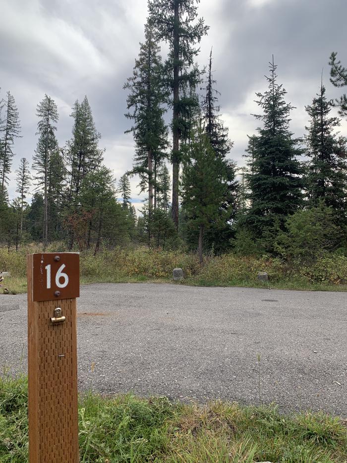 A photo of Site BLS16 in Loop 2 at Big Larch Campground  with campsite marker and parking area. A photo of Site BLS16 in Loop 2 at Big Larch Campground with campsite marker and parking area. 
