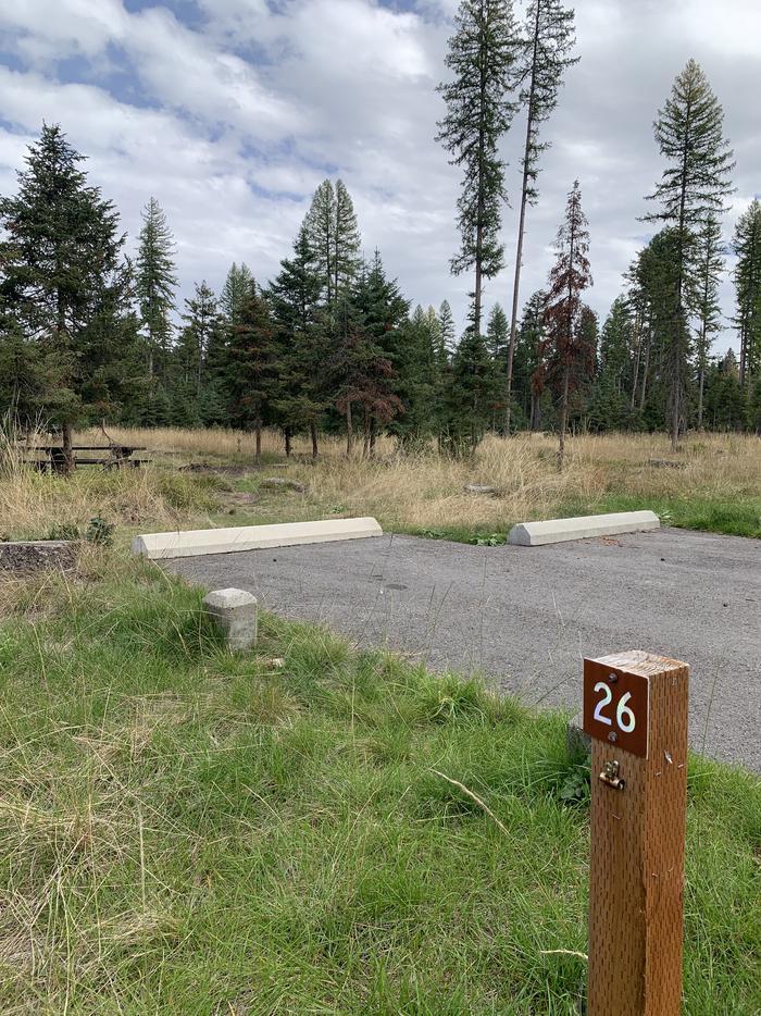 A photo of Site BLS26 in Loop 2 at BIG LARCH CAMPGROUND with campsite marker, parking area. 