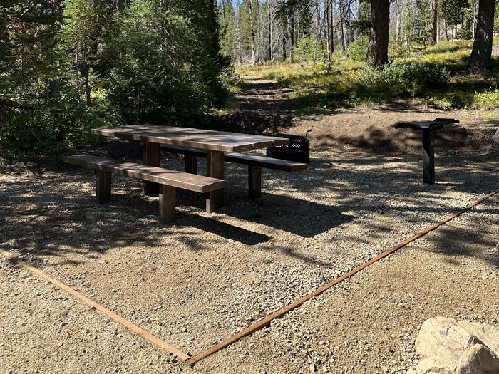 One picnic table, one utility table, one fireringSite 4 picnic area