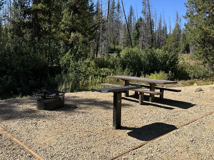 One picnic table, one fire ring, on utility tableSite 6 picnic area