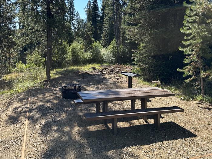One picnic table, one utility table, one fireringSite 11 picnic area