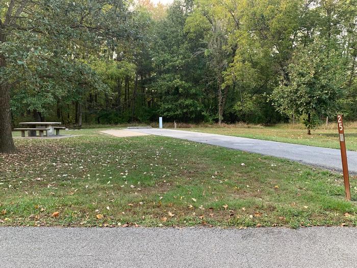 There is a picnic table located on the left side of the pad. Hook ups are rear right side of the parking pad. There is an additional pad on the left side of this site. 