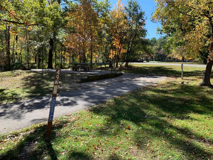 This is a handicap accessible site. The picnic table and fire pit are located on a paved pad to the left side on the main camping pad. All hookups are located on the left side. 