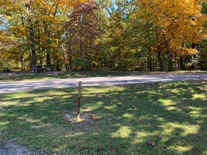 The picnic table is located on a paved pad to the left side on the main camping pad with the fire pit located near by. All hookups are located on the left side. This site is full hookup and is very close to the comfort station and drinking fountain. 