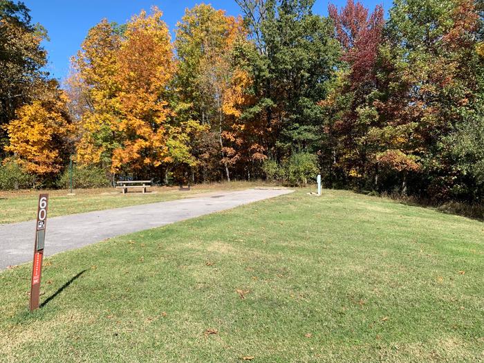 This is a full hookup site with all hookups located on the right side. Picnic table and fire pit are on the left side. With this site you have a view of the lake and it is near a comfort station and drinking fountain. 
