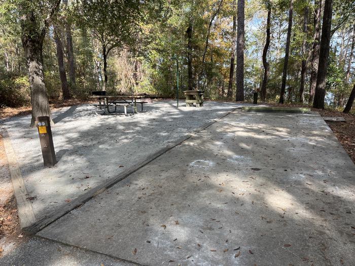 A photo of Site 69 of Loop SLOO at HARDRIDGE CREEK with Picnic Table, Electricity Hookup, Sewer Hookup, Fire Pit, Shade, Lantern Pole, Water Hookup