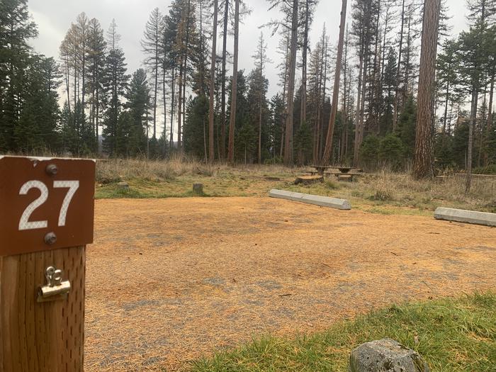 A photo of Site BLS27 in Loop 2 at BIG LARCH CAMPGROUND with campsite marker, parking area. 