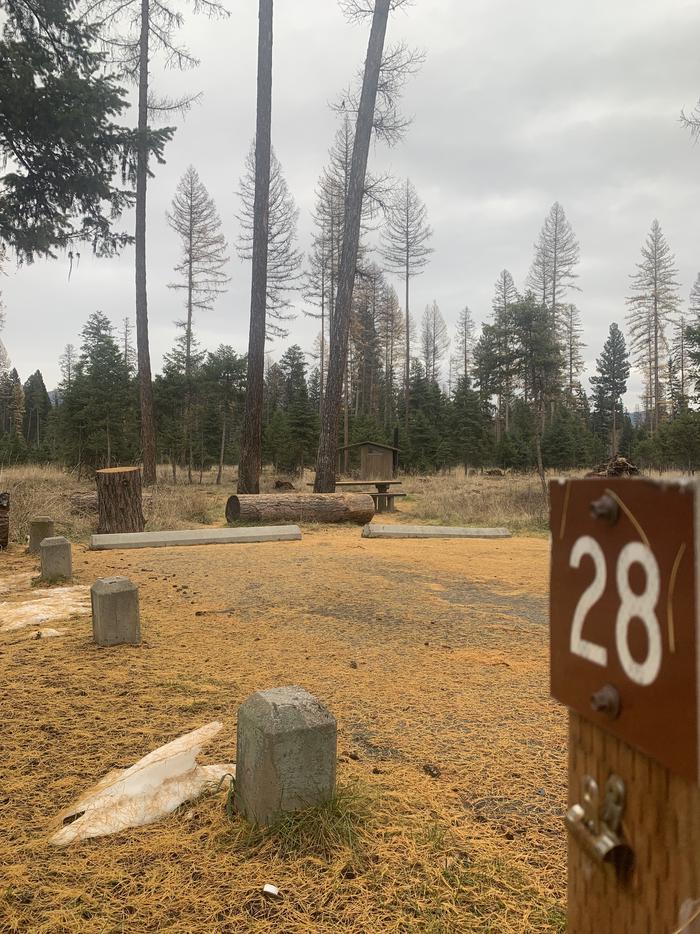 A photo of Site BLS28 in Loop 2 at BIG LARCH CAMPGROUND with campsite marker, parking area. 