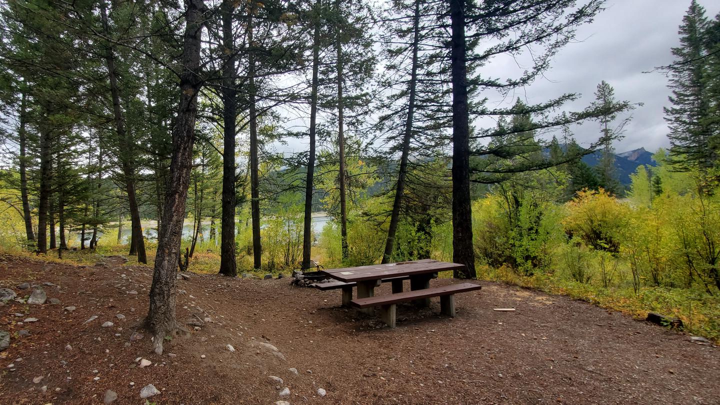 Campsite with picnic table and view of East Fork ReservoirCampsite