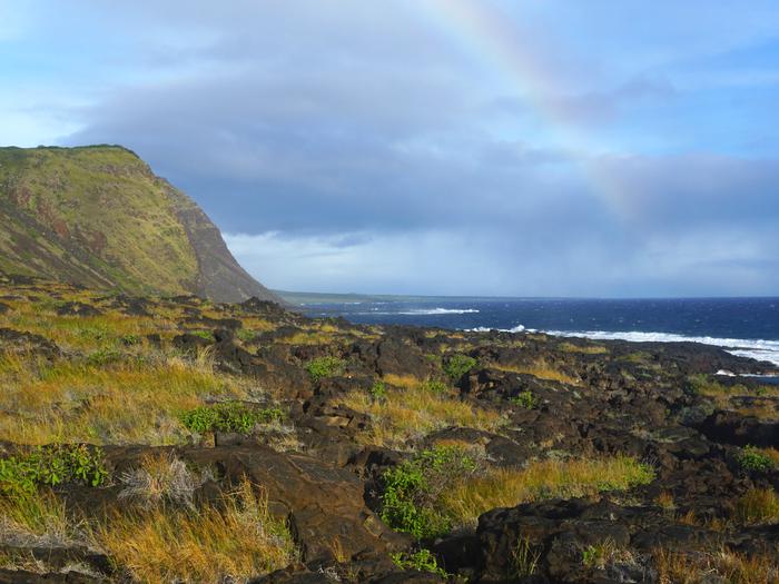 The Kaʻaha coastline with a rainbow in the backgroundRainbow Between Kaʻaha and Kalue