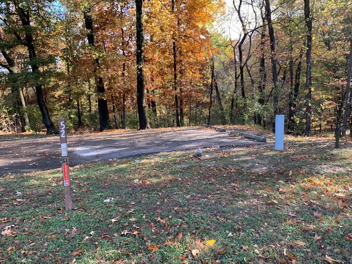 This site is located very close to a comfort station and drinking fountain. Picnic table and fire pit located to the left of the pad with hookups to the right side of the pad. This is a full hookup site. 