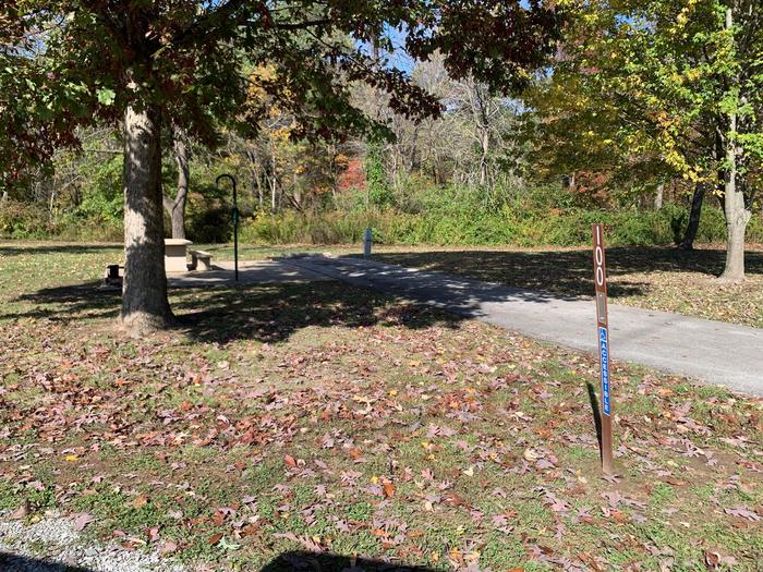 This site has  picnic table and fire pit located on the left side of the paved parking/camping pad and the hookups are located to the right of the pad. 