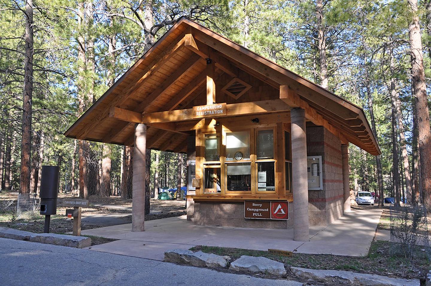 Wooden building with service windowsCampers can ask questions and check in for their campsite at the Campground Registration Kiosk